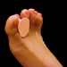 Latex toe spreader on foot