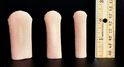 cloth covered gel toe caps all three sizes with ruler showing 2 and 1/4 inch length