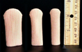 Pedifix cloth covered gel toe caps picture with ruler showing 2 and 1/4 inch length